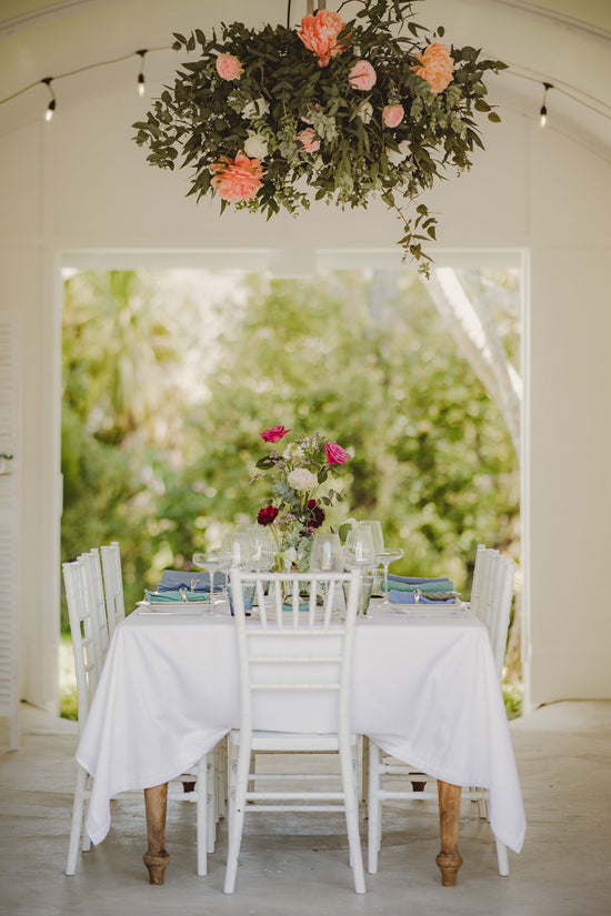 Floral installation hanging over a dinner table flower wedding warkworth matakana mangawhai