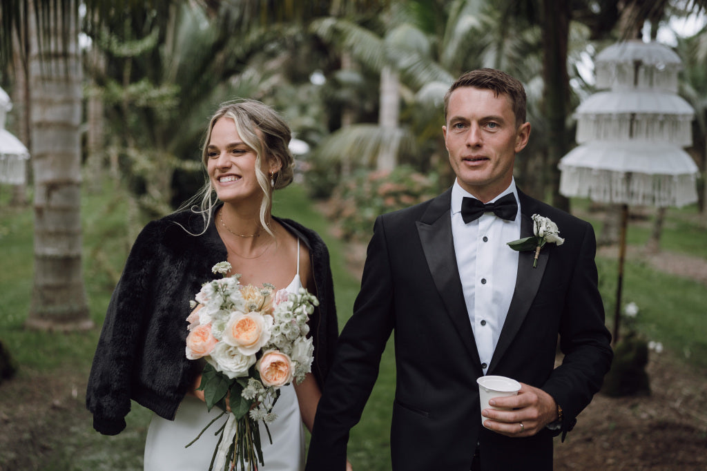 Couple holding hands after getting married