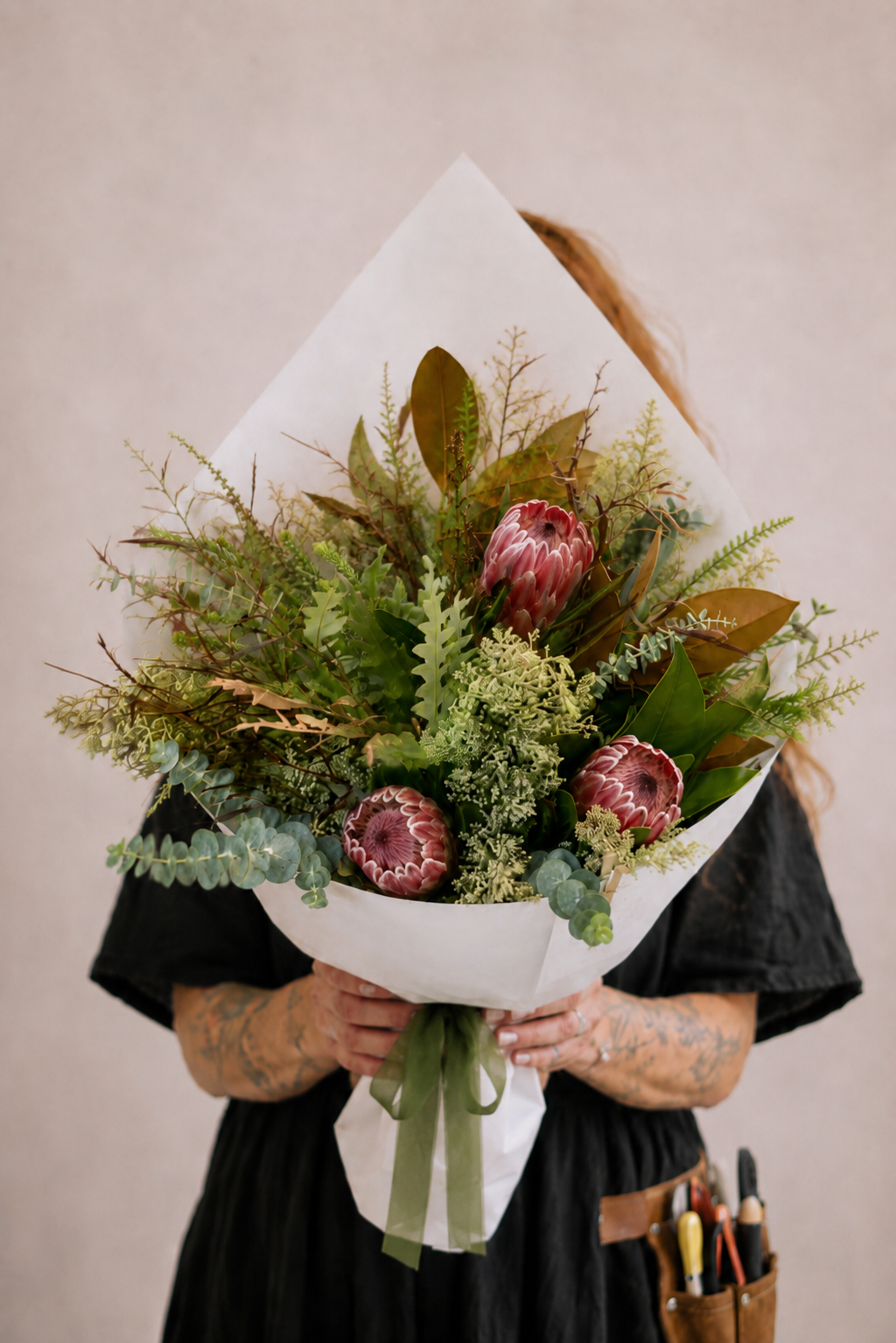 Winter foliage bouquet with protea
