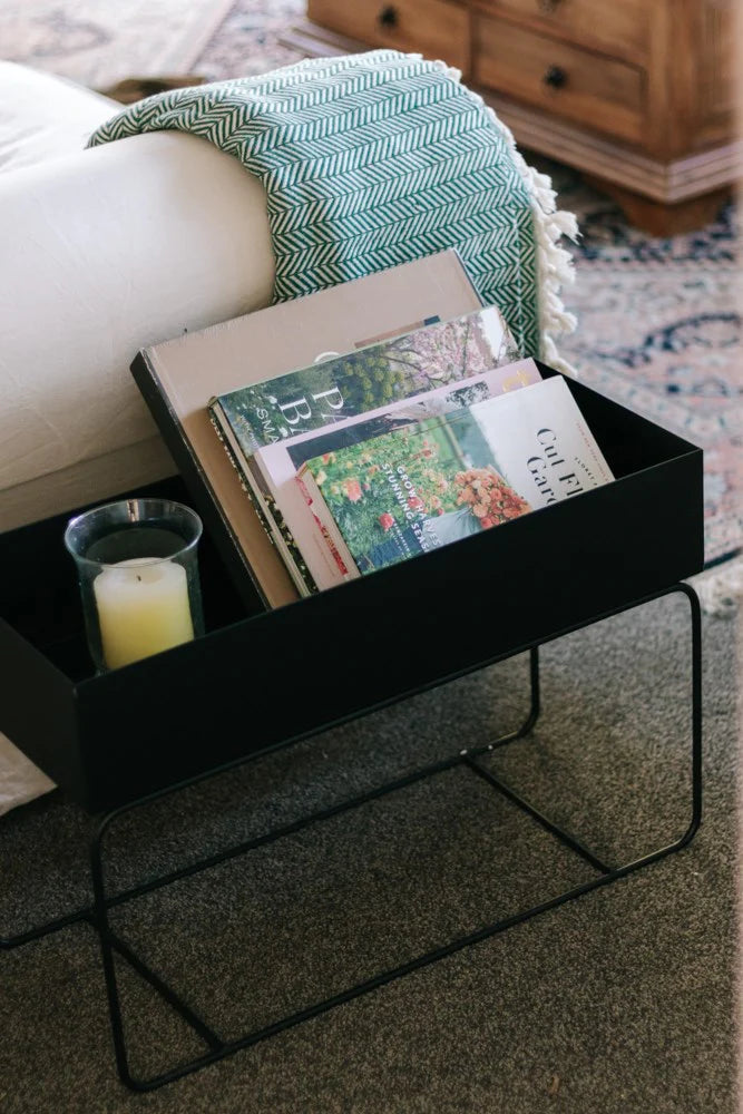 Black Metal Planter filled with books and candle
