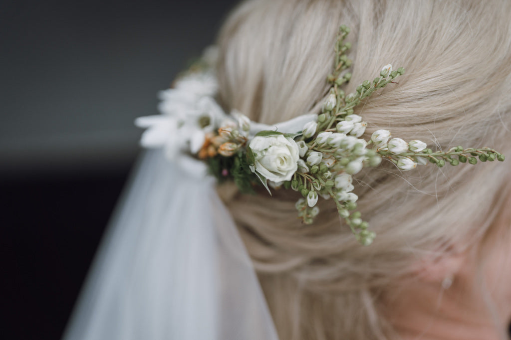 Close up of brides hair flowers