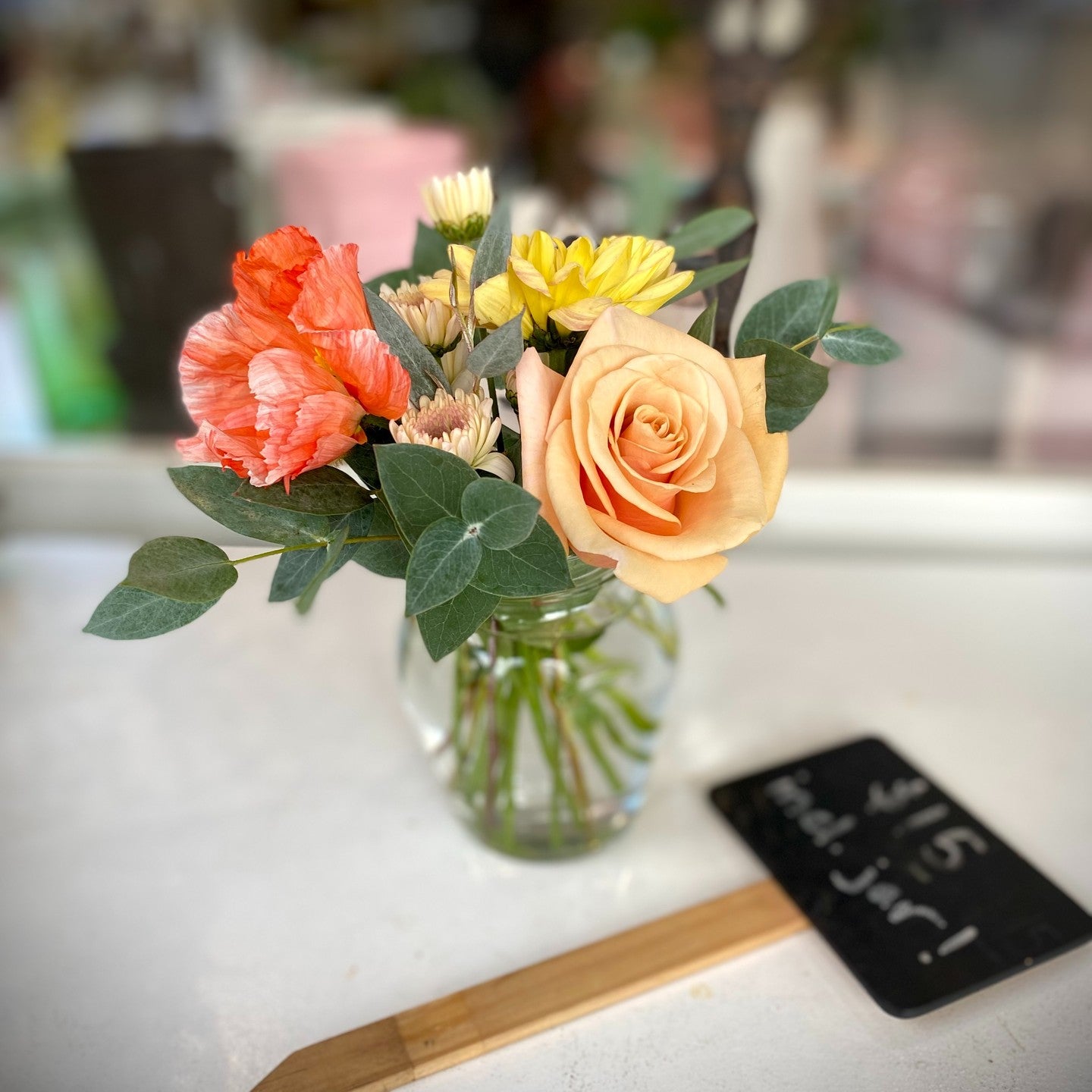 Small jar of fresh flowers