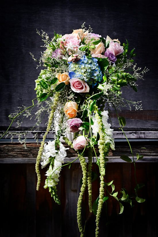 Beautiful fresh flower cascading wedding bouquet blue pink purple