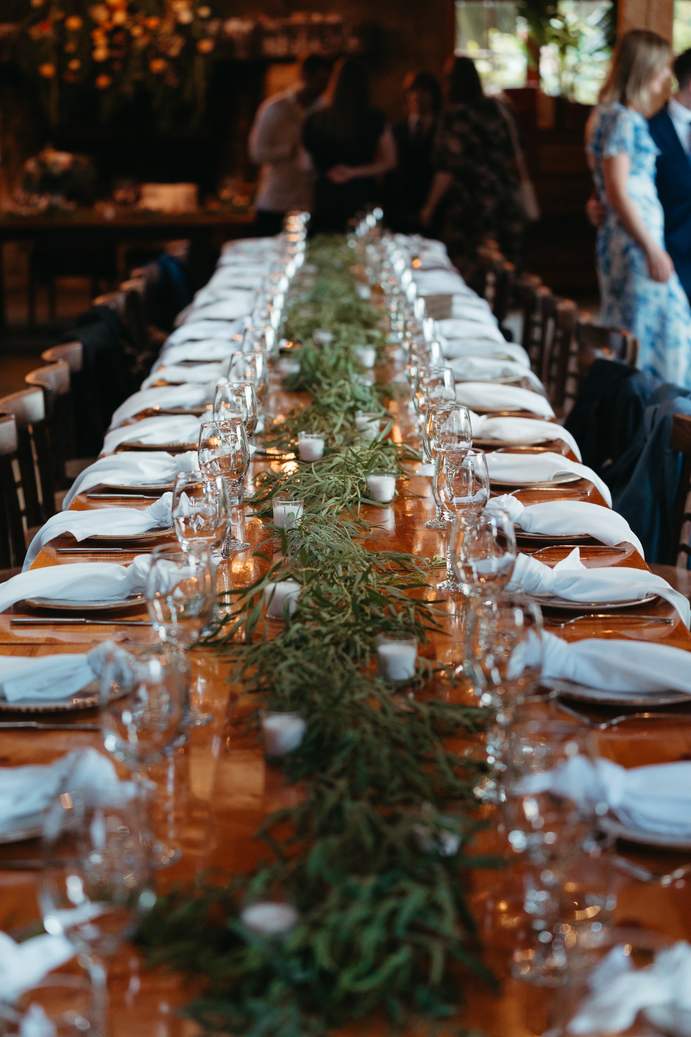 Fresh foliage decorating a table at a wedding reception