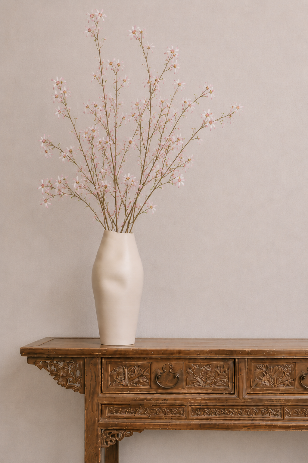 Ceramic vase with tall wild orchids