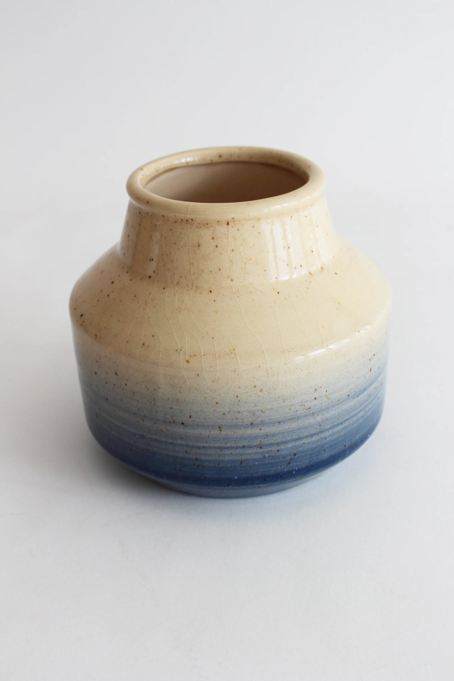Blue and neutral coloured ceramic vase