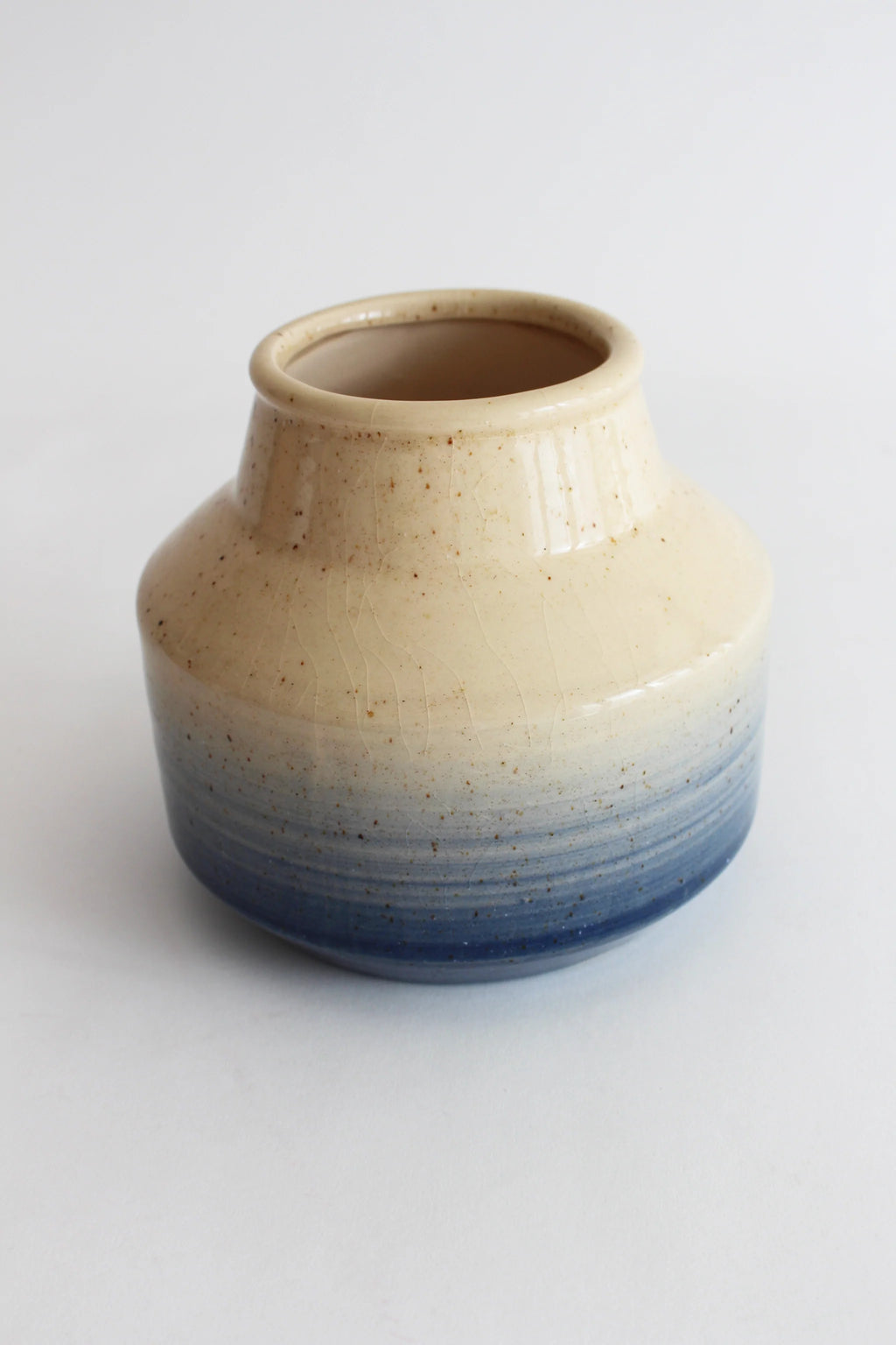 Blue and neutral coloured ceramic vase