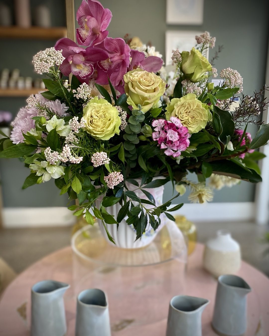 Large fresh flower arrangement of green and pink flowers