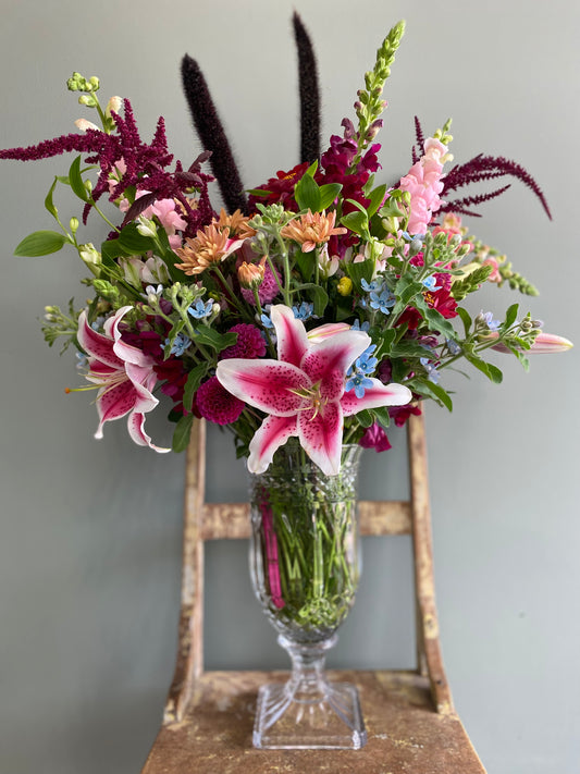 Beautiful fresh flowers in a large cut glass vase