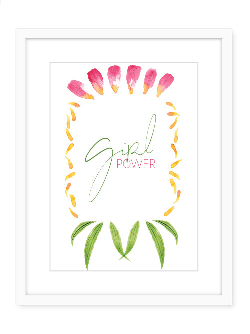 Framed art showing a flower necklace with text in the middle that reads Girl Power