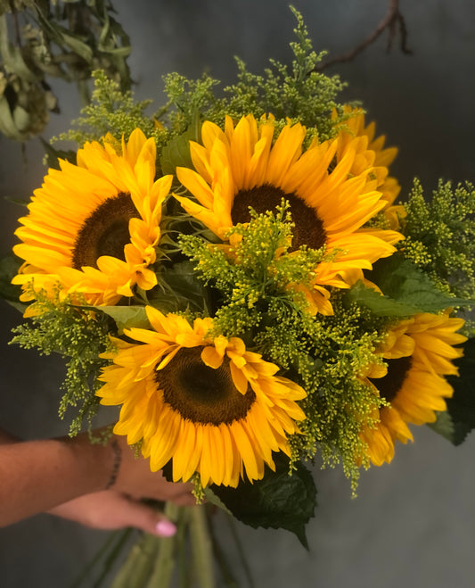 Beautiful bouquet of fresh yellow sunflowers