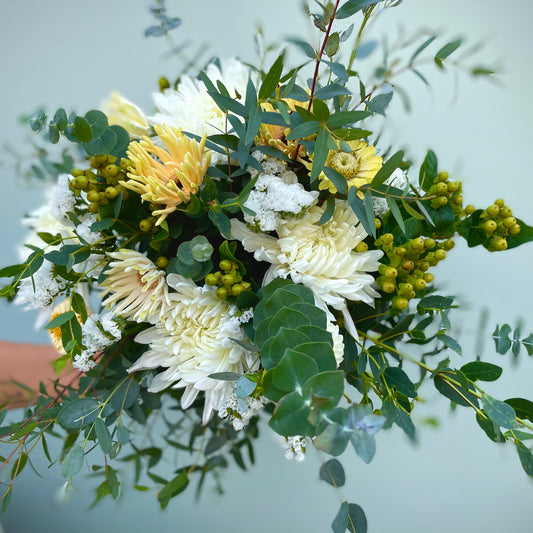 Beautiful fresh flower bouquet of white, green and yellow