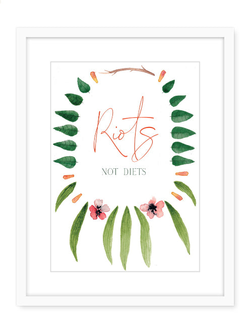 Framed art showing a flower necklace with text in the middle that reads Riots not Diets
