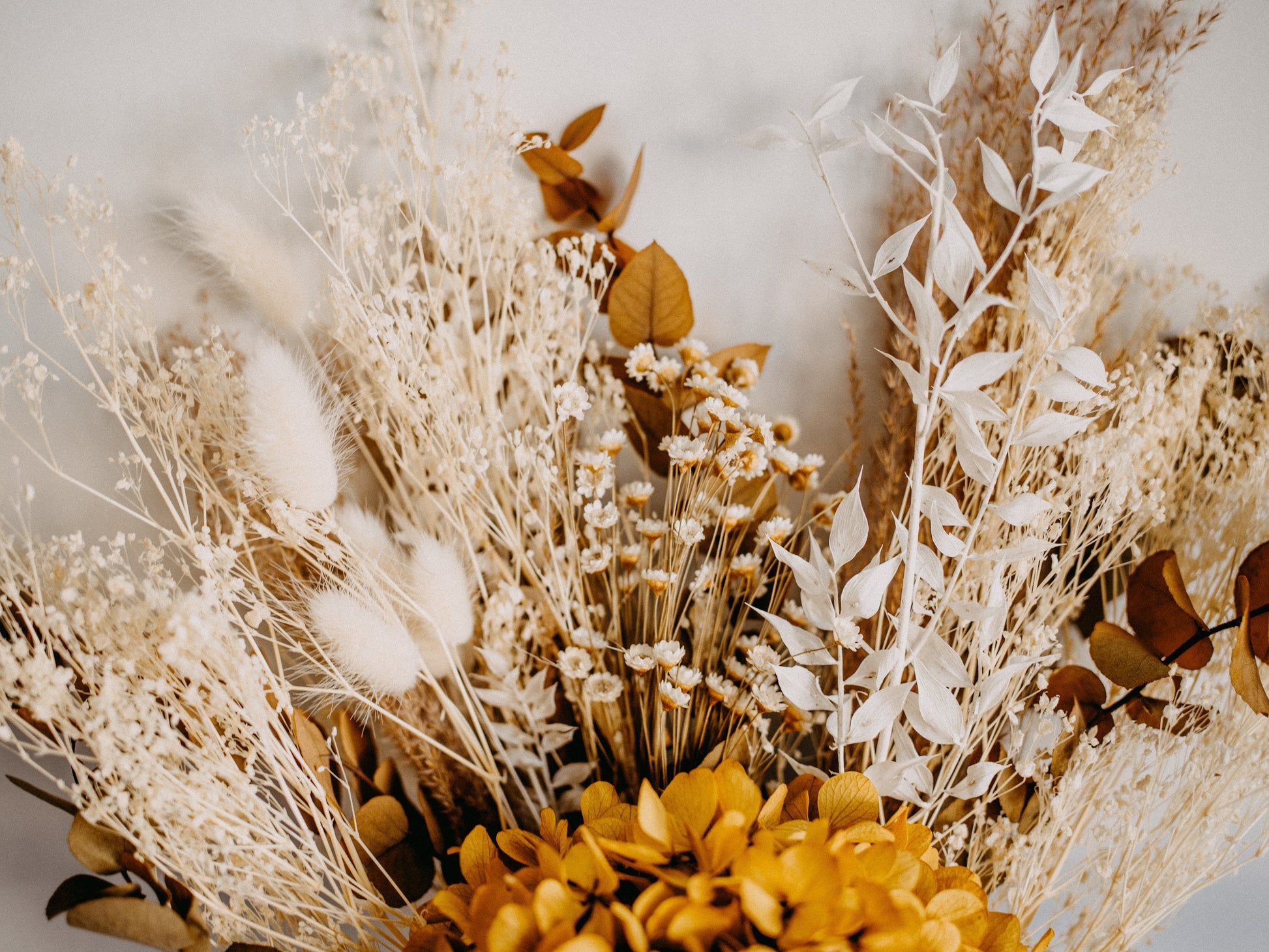 Beautiful bunch of dried flowers in yellow and neutral colours